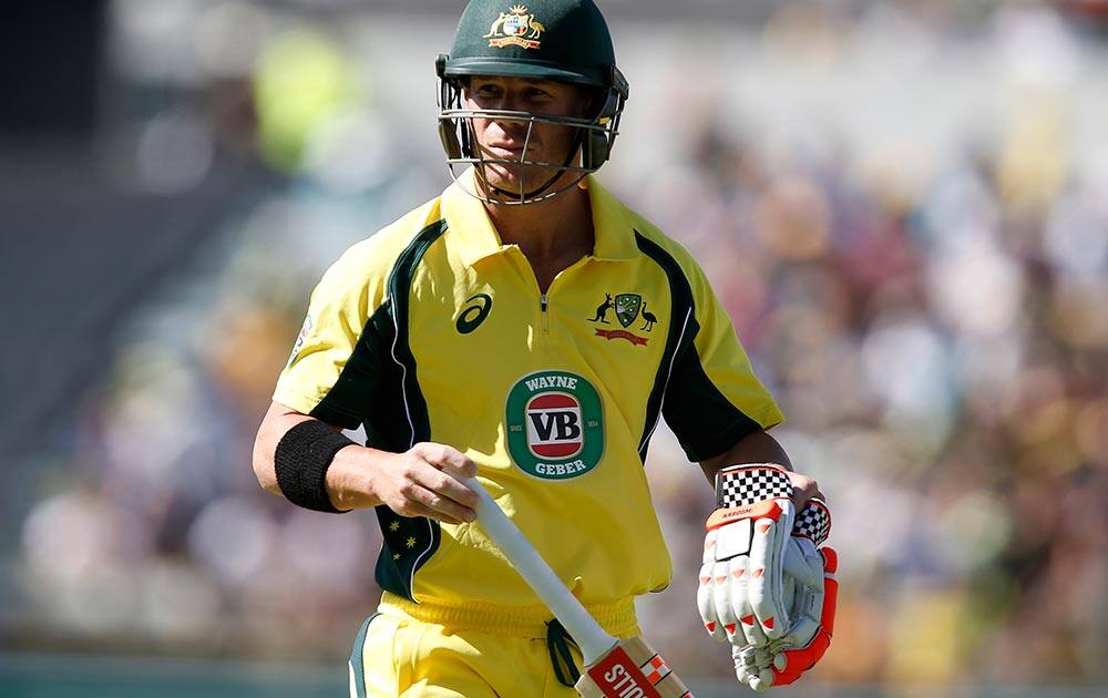 David Warner walks back to the pavilion after losing his wicket during their one day international cricket match against India, in Perth, Australia.