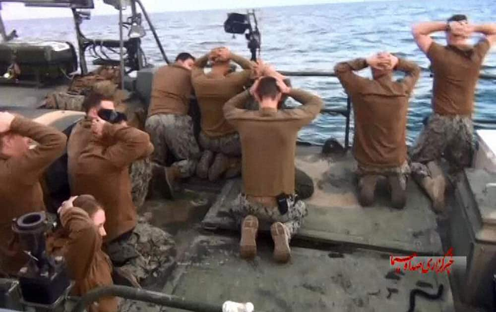 This picture released by the Iranian state-run IRIB News Agency on Wednesday, Jan. 13, 2016, shows detention of American Navy sailors by the Iranian Revolutionary Guards in the Persian Gulf, Iran. Iranian state television is reporting that all 10 U.S. sailors detained by Iran after entering its territorial waters have been released. Irans Revolutionary Guard said the sailors were released Wednesday after it was determined that their entry was not intentional.