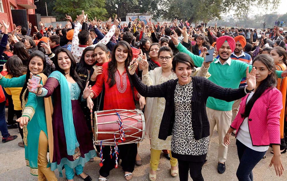 Students celebrate the Lohri festival at a college in Jalandhar.