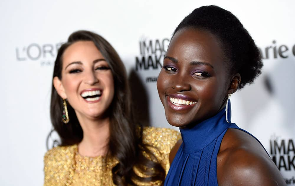 Choice Stylist honoree Micaela Erlanger, left, and actress Lupita Nyong'o share a laugh as they pose together at the Marie Claire Image Maker Awards at the Chateau Marmont in Los Angeles.