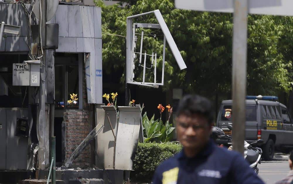 A police post in the center of Thamrin street across from Sarinah shopping mall is damaged after a bombing in Jakarta, Indonesia.