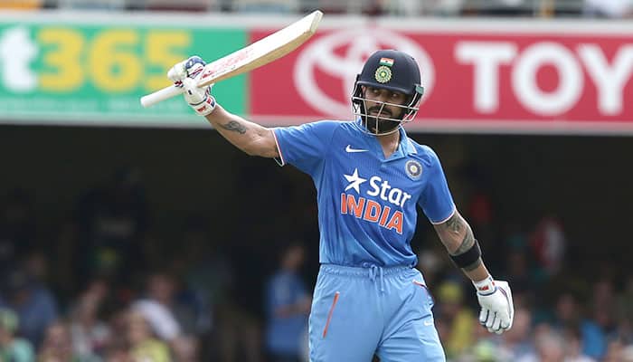 Virat Kohli waves to the crowd after reaching 50 runs during the 2nd One Day International cricket match between Australia and India in Brisbane, Australia.