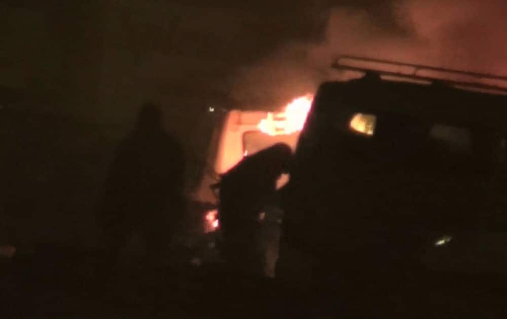 IN THIS GRAB TAKEN FROM VIDEO BY ASSOCIATE PRESS TELEVISION, AN ARMED POLICEMAN PATROLS THE AREA AFTER AN ATTACK ON A HOTEL, IN OUAGADOUGOU, BURKINA FASO.
