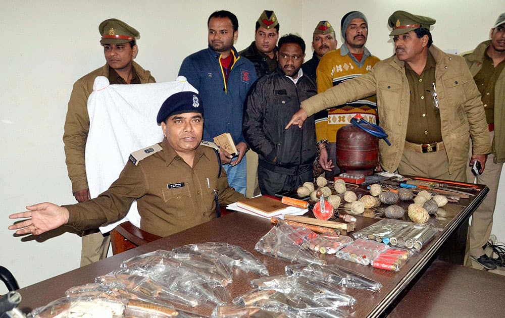 Police with two persons arrested under a campaign to curb illegal arms trade in Moradabad.