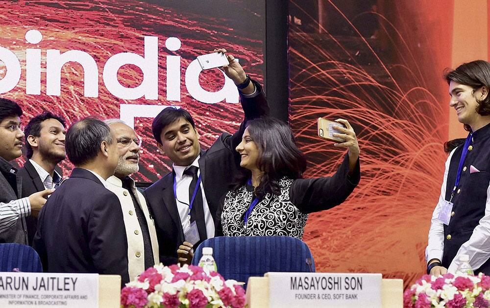 Prime Minister Narendra Modi poses for a selfie with the delegates during the launch of Startup India action plan at Vigyan Bhawan in New Delhi.