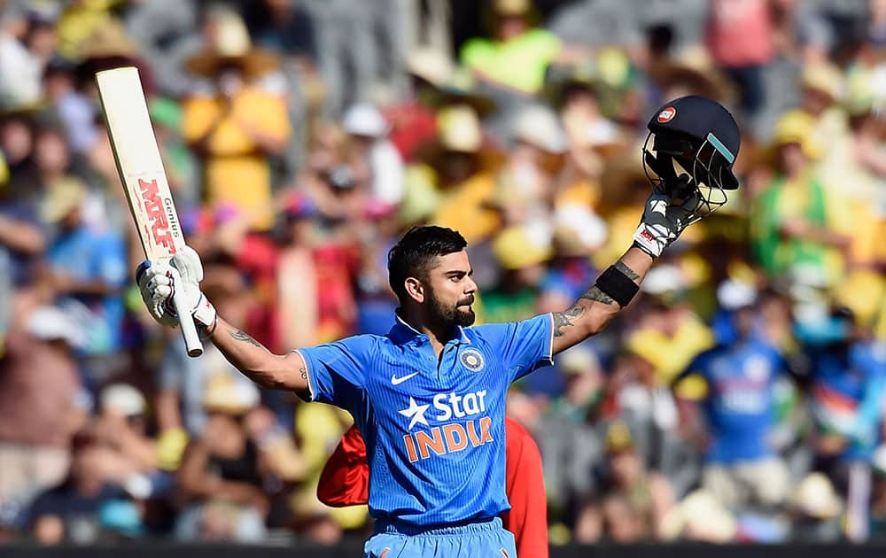 India's Virat Kohli celebrates after scoring a century against Australia during their one day international cricket match in Melbourne, Australia.