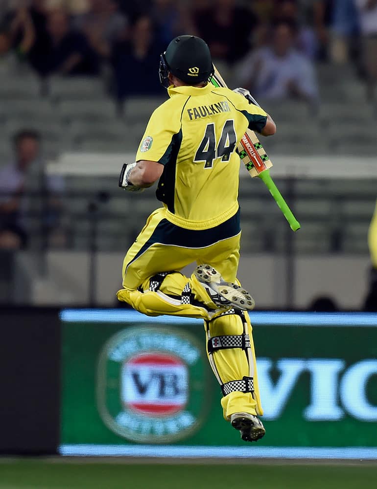 Australia's James Faulkner jumps after defeating India during their one day international cricket match in Melbourne, Australia.