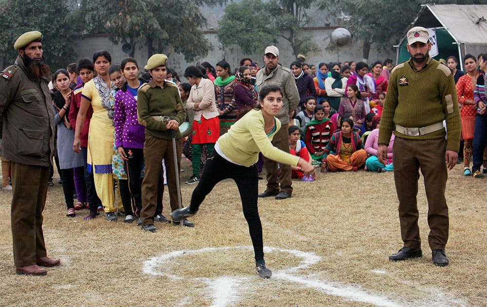 Candidates participate in a physical fitness test during J&K police women recruitment rally at Gulshan Ground in Jammu.