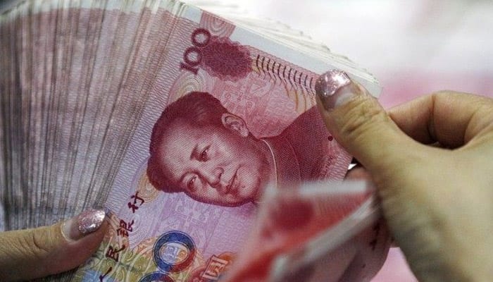 China orders foreign banks to hold yuan