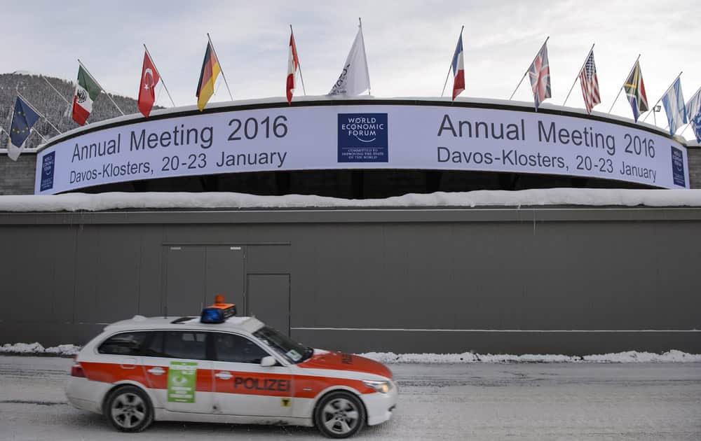 A police car passes the congress center before the opening of the Annual Meeting of the World Economic Forum, WEF, in Davos.