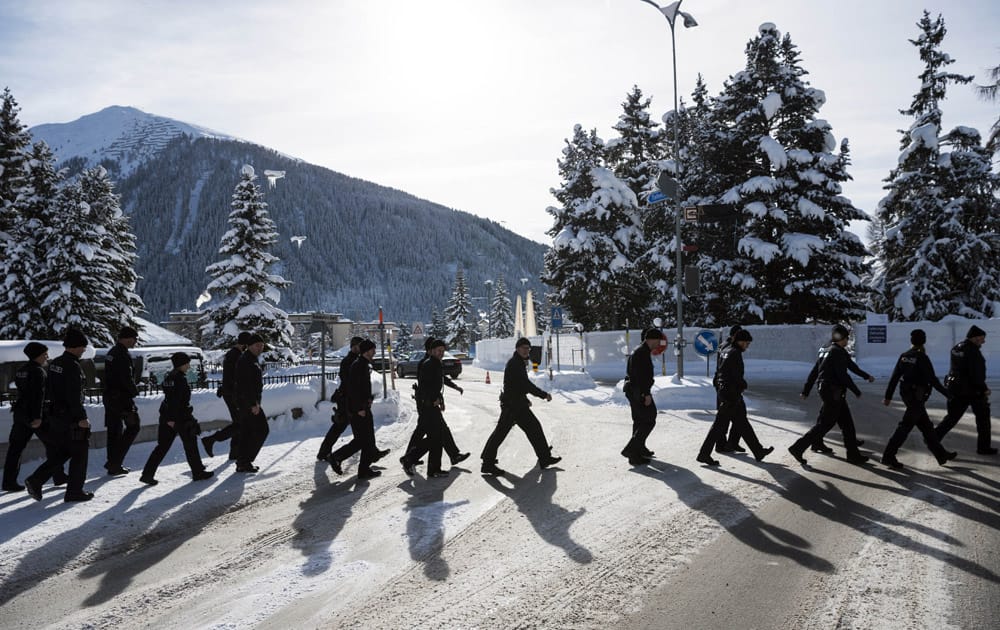 A group of police walk through the city prior to the World Economic Forum.