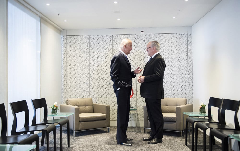 Swiss Federal President Johann Schneider-Amman, right, welcomes US Vice-President Joe Biden, left, at the airport in Zurich-Kloten, Switzerland.