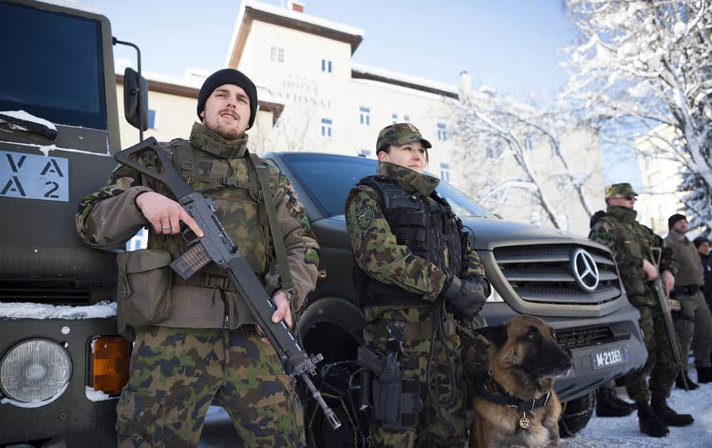 Members of the Swiss army pose for a photo after a press conference of police and army on security matters ahead of the World Economic Forum.