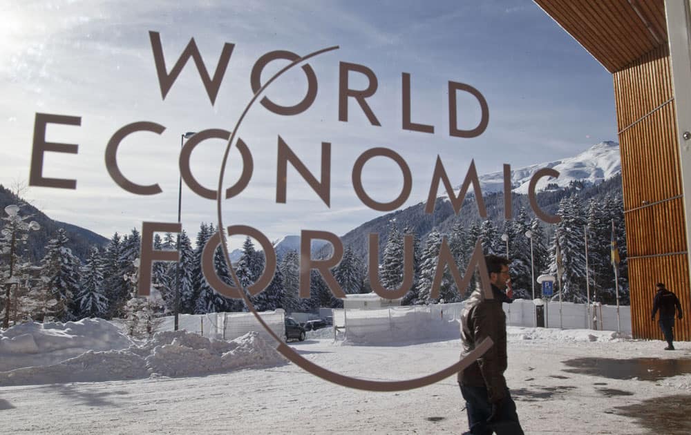 A man walks at the main entrance of the congress center where the World Economic Forum will take place later this week in Davos, Switzerland, Monday Jan 18, 2016.