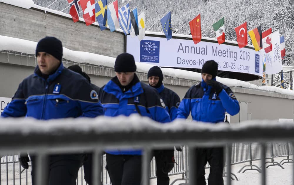 Swiss Police walk outside the congress center on the eve of the opening of the Annual Meeting of the World Economic Forum, WEF, in Davos, Switzerland, Tuesday, Jan 19, 2016. 