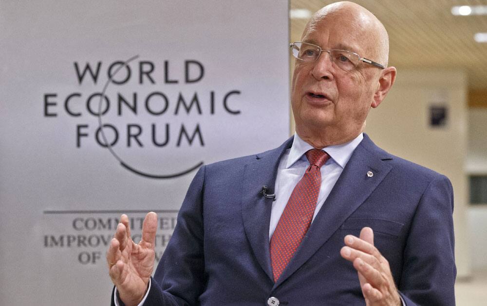 President and Founder of the World Economic Forum Klaus Schwab gestures as he speaks during an interview with The Associated Press in Davos, Switzerland, Monday Jan 18, 2016.
