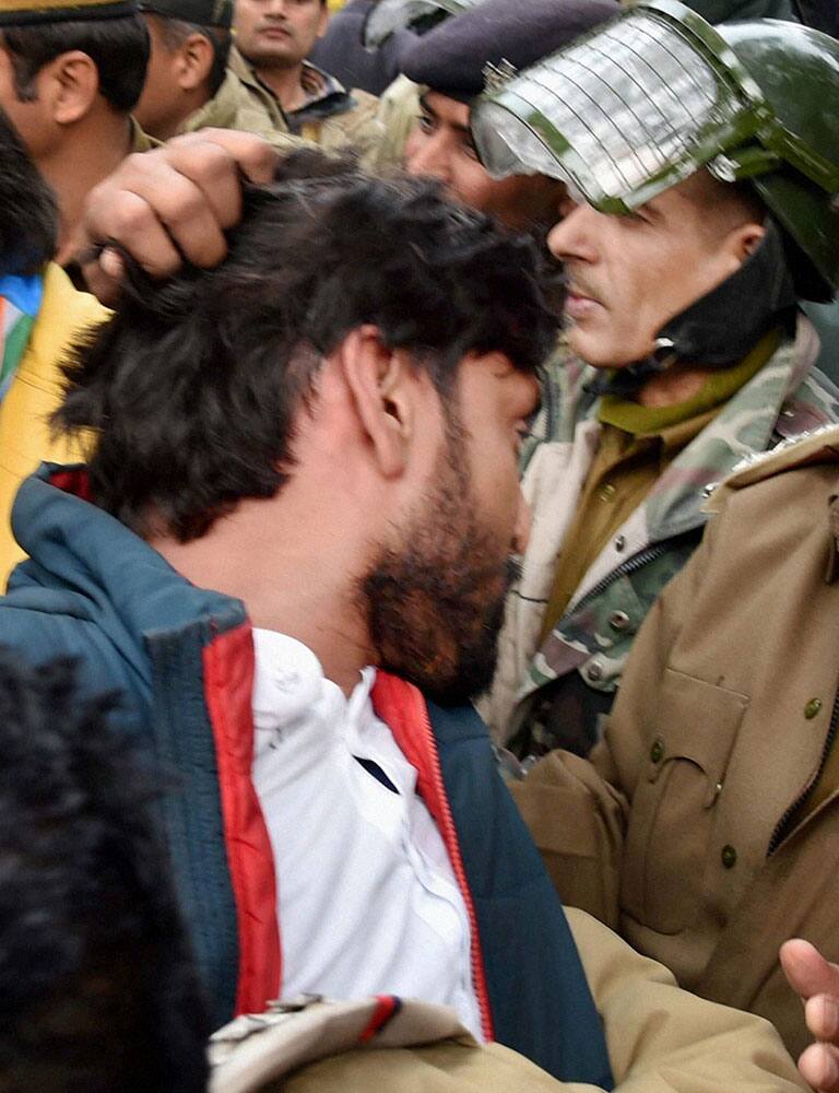 Police detain Youth Congress workers during a protest against the Ministry of Human Resource Development in New Delhi.