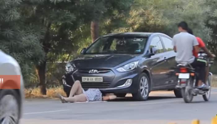 This girl went under her car on a busy street. What happened next ...