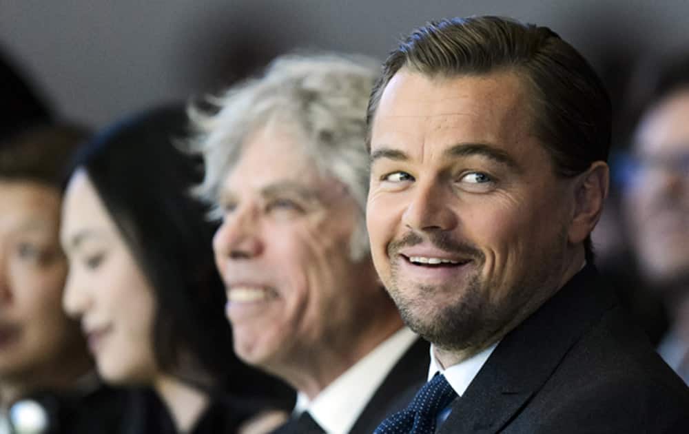 US actor Leonardo DiCaprio, foreground, reacts during the Crystal Award Ceremony on the eve of the opening of the 46th Annual Meeting of WEF.