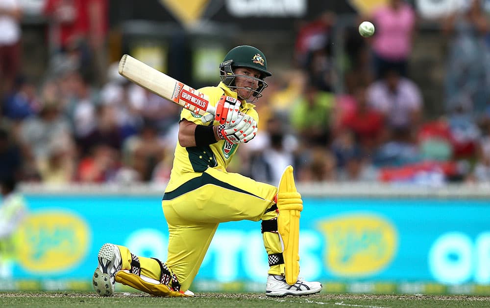 David Warner plays a shot during the team's One Day International cricket match against India in Canberra, Australia.