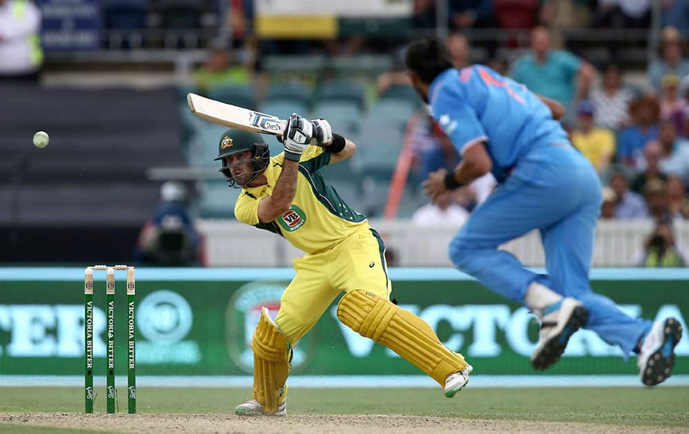 Glenn Maxwell plays a shot as India's Ishant Sharma runs in during their One Day International cricket match in Canberra, Australia.