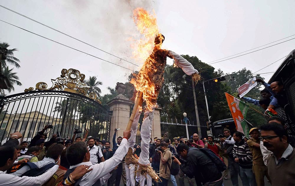 Youth Congress activists burn the effigy of Union Labour and Empolyment Minister Bandaru Dattatreya in front of Governor House in Kolkata on Wednesday during a protest over the suicide by dalit student Rohith Vemula.