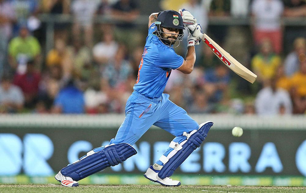 Virat Kohli plays a shot against Australia during their One Day International cricket match in Canberra, Australia.