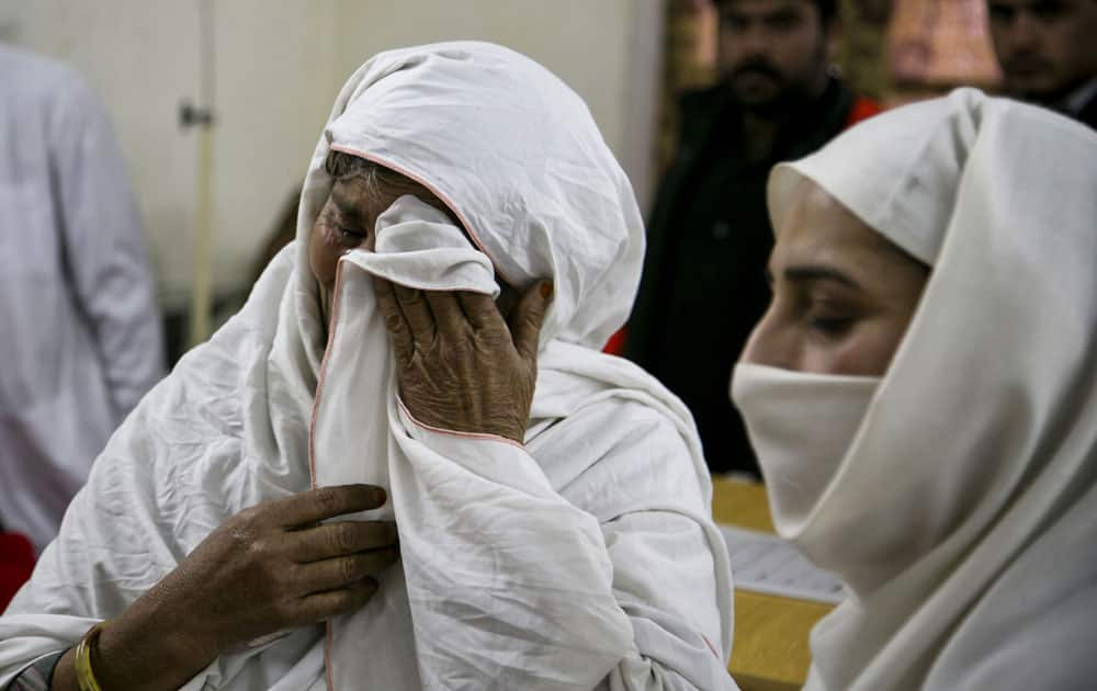 A Pakistani mother cries after her son was injured in an attack in Charsadda town.