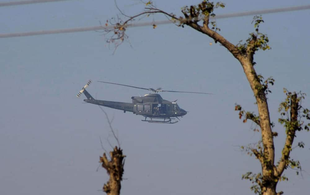 A Pakistan army helicopter flies over the Bacha Khan University, which is under attack by gumen in Charsadda town.
