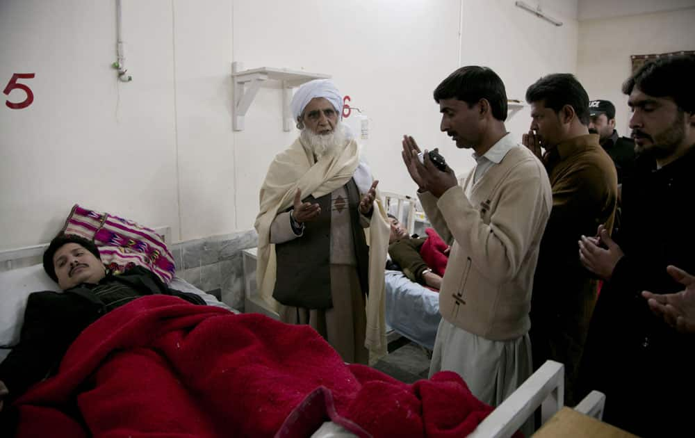 Pakistan villagers pray for the recovery of people injured in an attack on a university, at a local hospital in Charsadda town.
