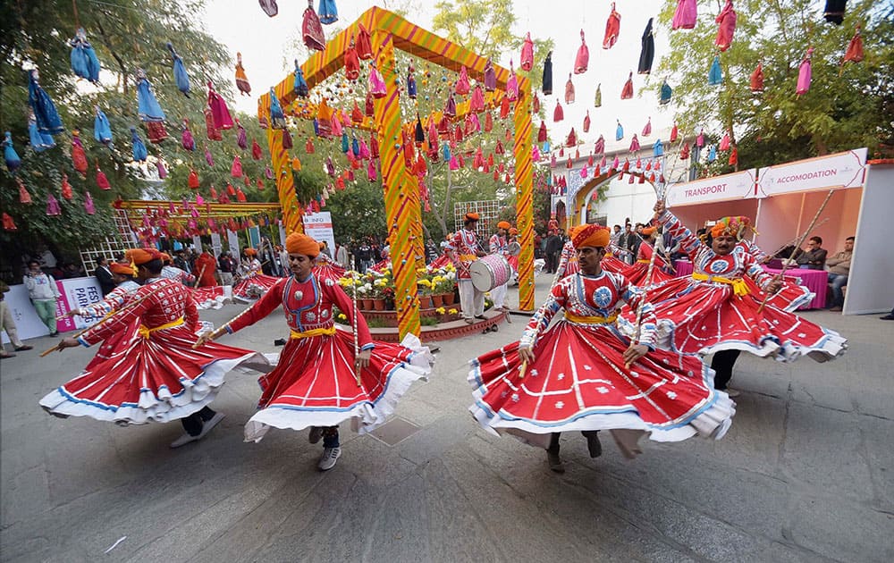Rajasthani folk Dancers perform on the eve of Jaipur Literature Festival at Diggi Palace in Jaipur.