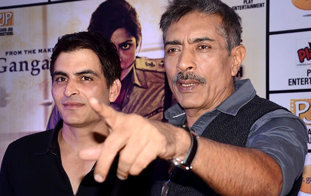 Bollywood film director Prakash Jha (R) actor Manab Kaul during a media conference for their film Jai Gangajal in Kolkata.