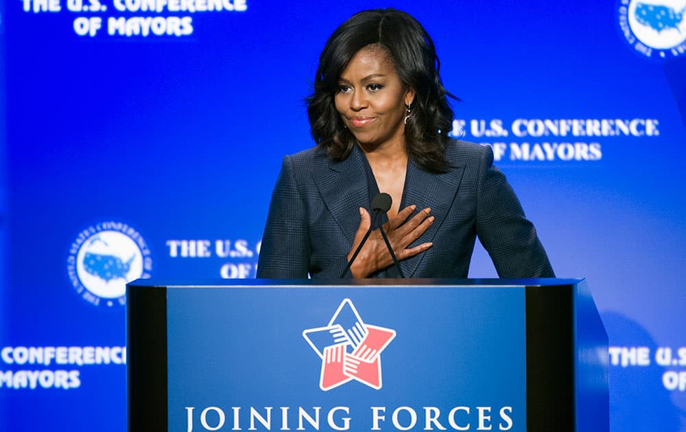 First lady Michelle Obama pauses while speaking at the US Conference of Mayors Winter Meeting in Washington.