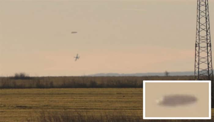 Are those military aircraft trailing a UFO?