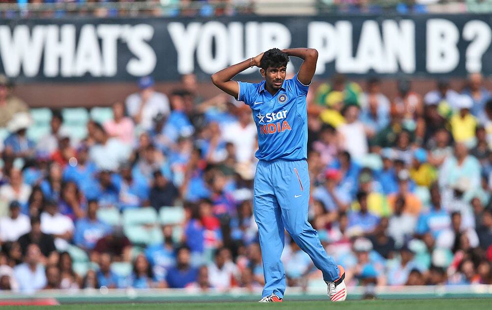 Jasprit Bumrah looks dejected after being hit for six during a One Day International cricket match against Australia in Sydney.