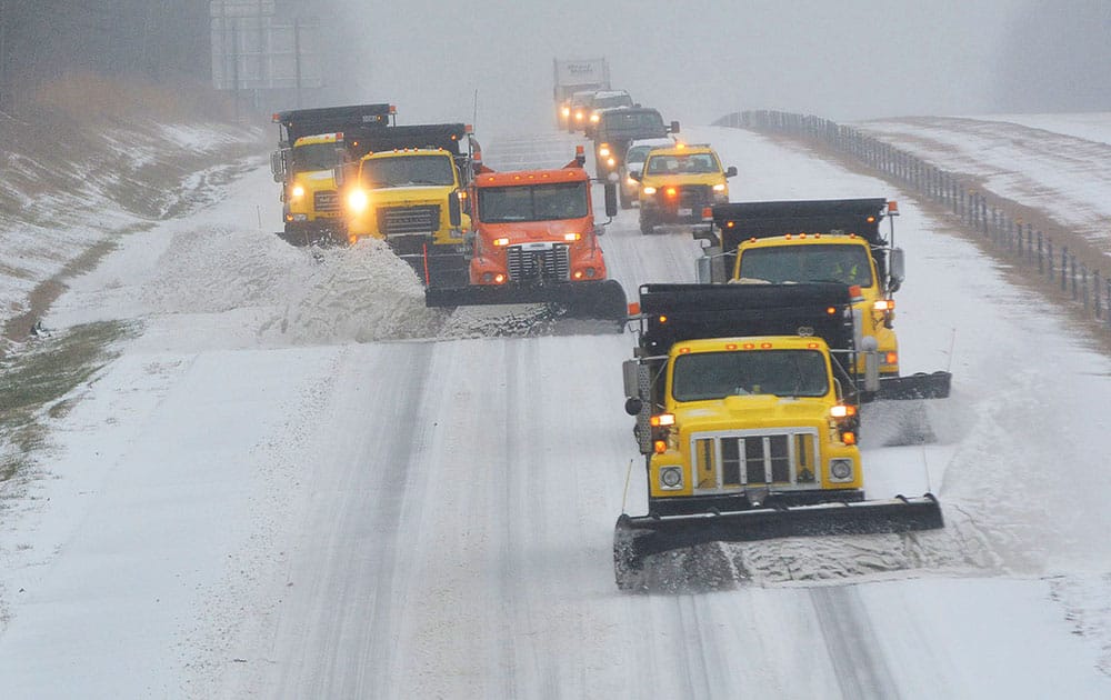 Snow plows and traffic make their way south along Interstate 40 in Durham and Orange county in N.C.