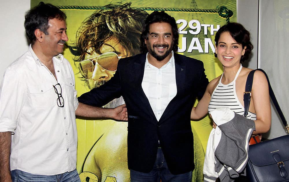 Bollywood actors R Madhavan, Kangana Ranaut with filmmaker Rajkumar Hirani during the screening of film Saala Khadoos, in Mumbai.