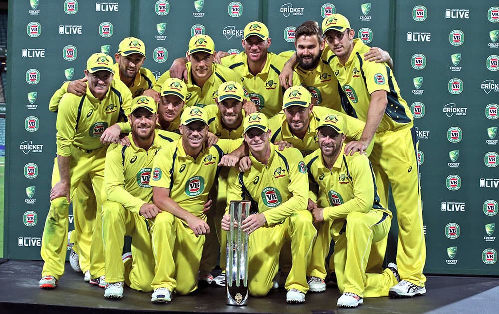 Australia cricket team pose as they celebrate winning their One Day International cricket series against India in Sydney, Australia.