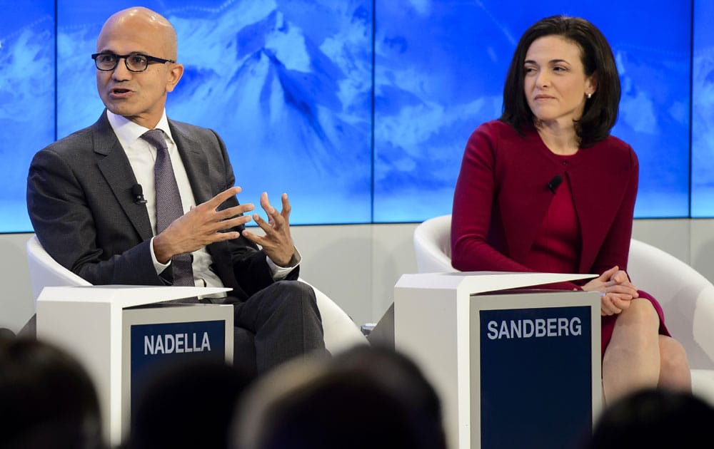 CEO of Microsoft Corporation Satya Nadella, left, and Chief Operating Officer of Facebook Sheryl Sandberg, right, speak during a panel session on the first day of the Annual Meeting of the World Economic Forum, WEF, in Davos, Switzerland, Wednesday, Jan 20, 2016.
