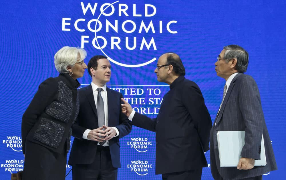 Managing Director of the International Monetary Fund, Christine Lagarde, left, Britain's Chancellor of the Exchequer George Osborne, 2nd left, Indian's Finance Minister Arun Jaitley, 2nd right, and Governor of the Bank of Japan. Haruhiko Kuroda, talk after a panel