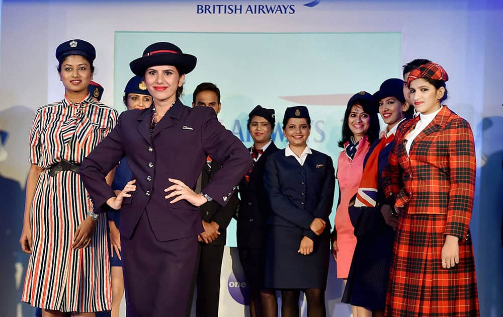 Crew members of British Airways showcase uniforms from the airlines 76-year history during a fashion show in Bengaluru on Friday night to mark 10 years of the airlines flying to the city.