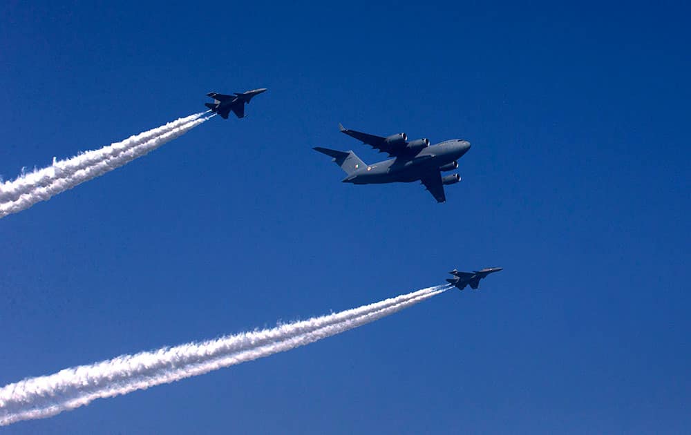 An Indian Air-force C-17 aircraft, centre, along with two Su-30 MKI aircrafts, makes a formation during the full dress rehearsal of the Republic Day parade, in New Delhi.