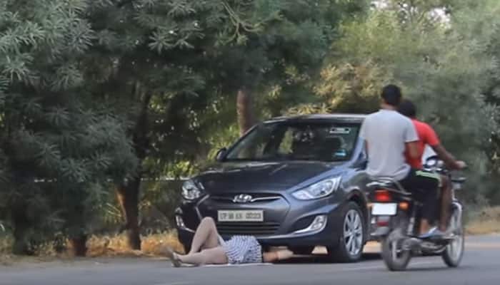 Oh gosh! Woman underneath the car - Watch what happens next