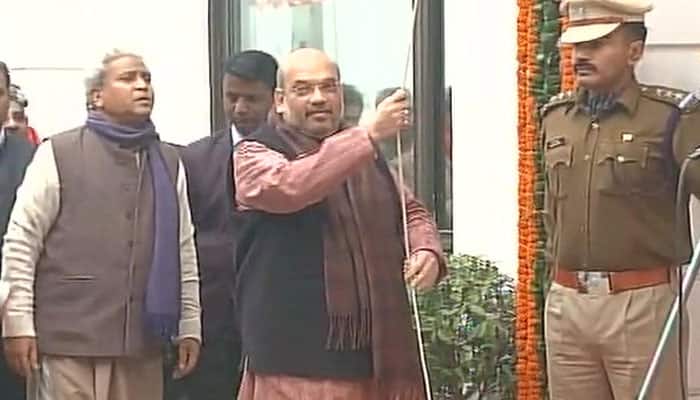 Amit Shah hoists national flag at BJP headquarters in Delhi