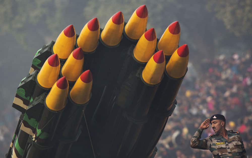 An Indian soldier in charge of multi barrel rocket launchers salutes Indian President as he participates in the Republic Day parade in New Delhi.