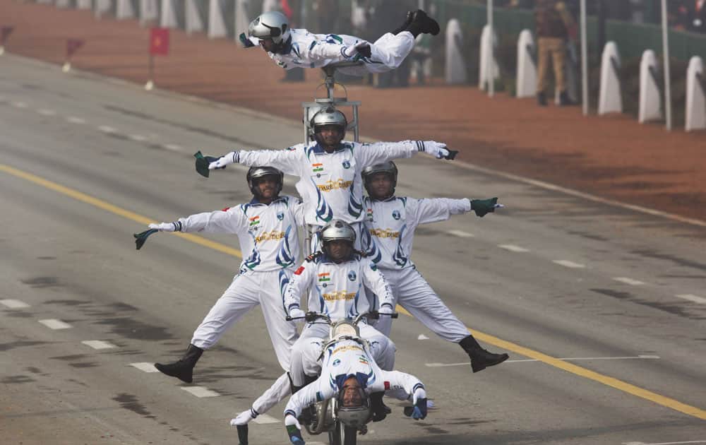 Motorcycle display team of Indian army's 'Corps of Signals', popularly known as 'Dare Devils', make a formation on a motorcycle as they roll down Rajpath during the Republic Day parade in New Delhi.
