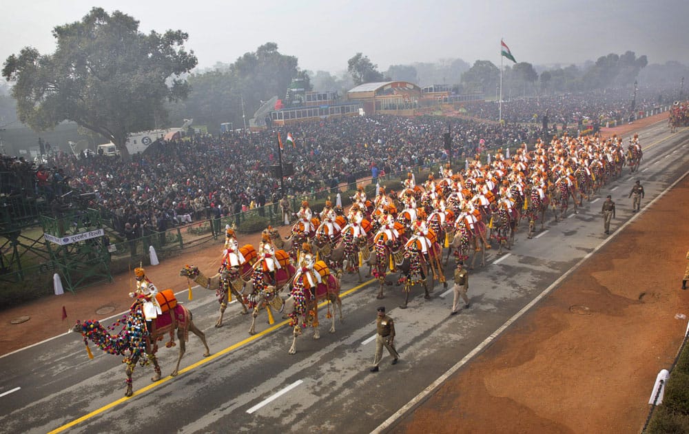 A contingent of camel mounted soldiers of Indian Border Security Force (BSF), march down Rajpath during Republic Day parade in New Delhi.