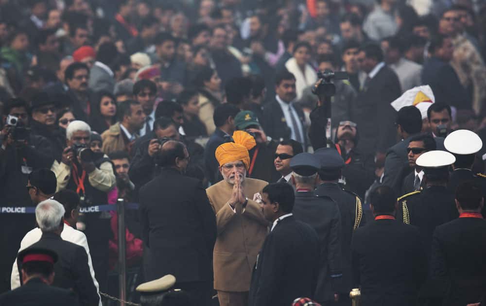 Indian Prime Minister Narendra Modi greets people as he arrives to attend the Republic Day parade in New Delhi.