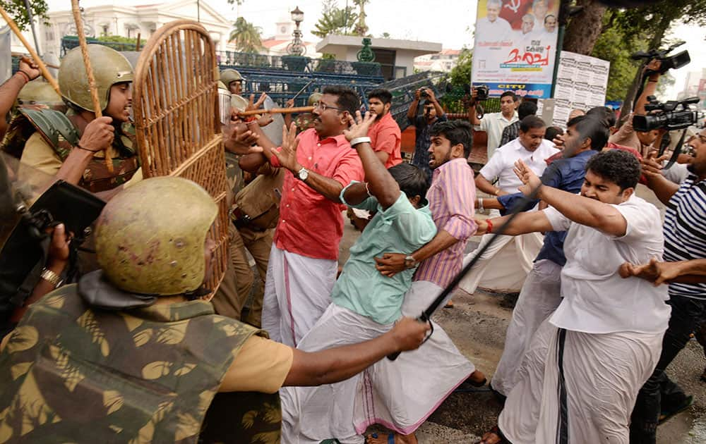 Police cane charge Bharatiya Janata Yuva Morcha members during a protest in Thiruvananthapuram.