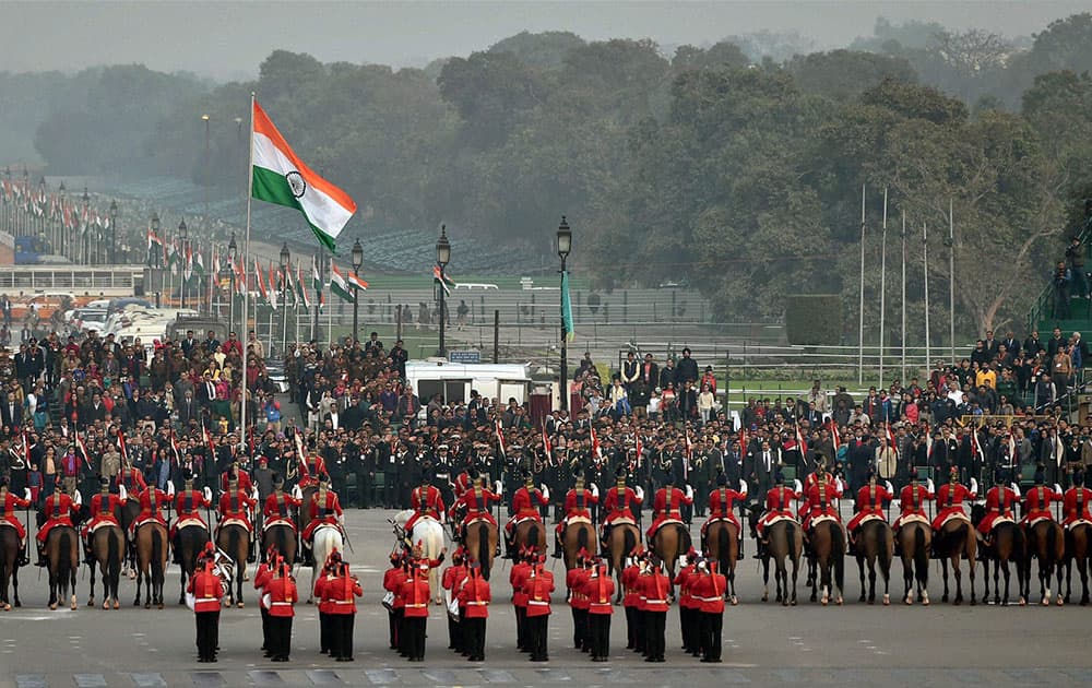 Flag hoisting ceremony during the full dress rehearsal for the Beating Retreat ceremony, in New Delhi.